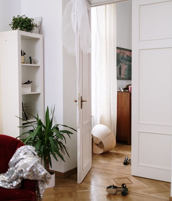 Person meditating peacefully in a bright room with soft natural light.